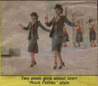 Two sleek girls about town, "Rock Follies" style.